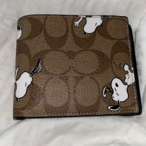 Brand New - Peanuts Line - Snoopy - Coach Wallet. Never Used.